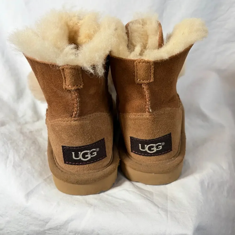 UGG Toddler Gita chestnut boots.  Front bow pom-poms.  Size 8T. Worn once